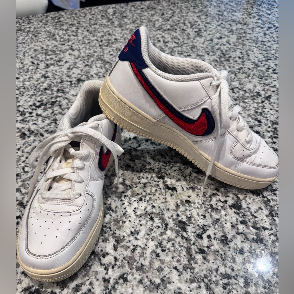 Nike White Low-Top Sneakers with Red & Navy Swoosh Detail